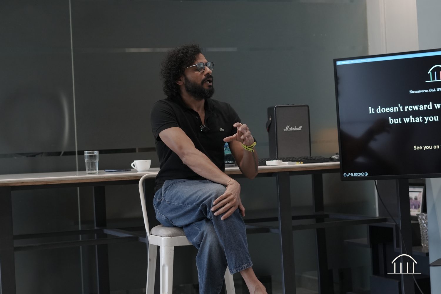 Rajat Asawa beside the framework slide
